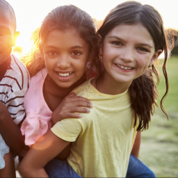Kids playing at sunset