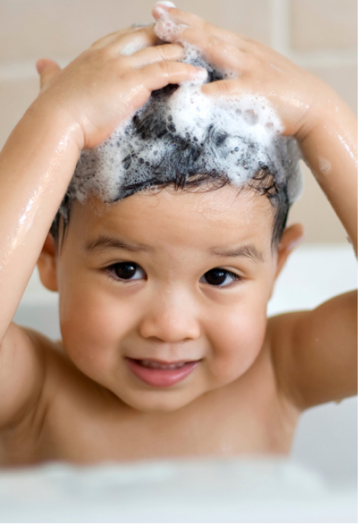 Child bathing in a bathtub with bubbles